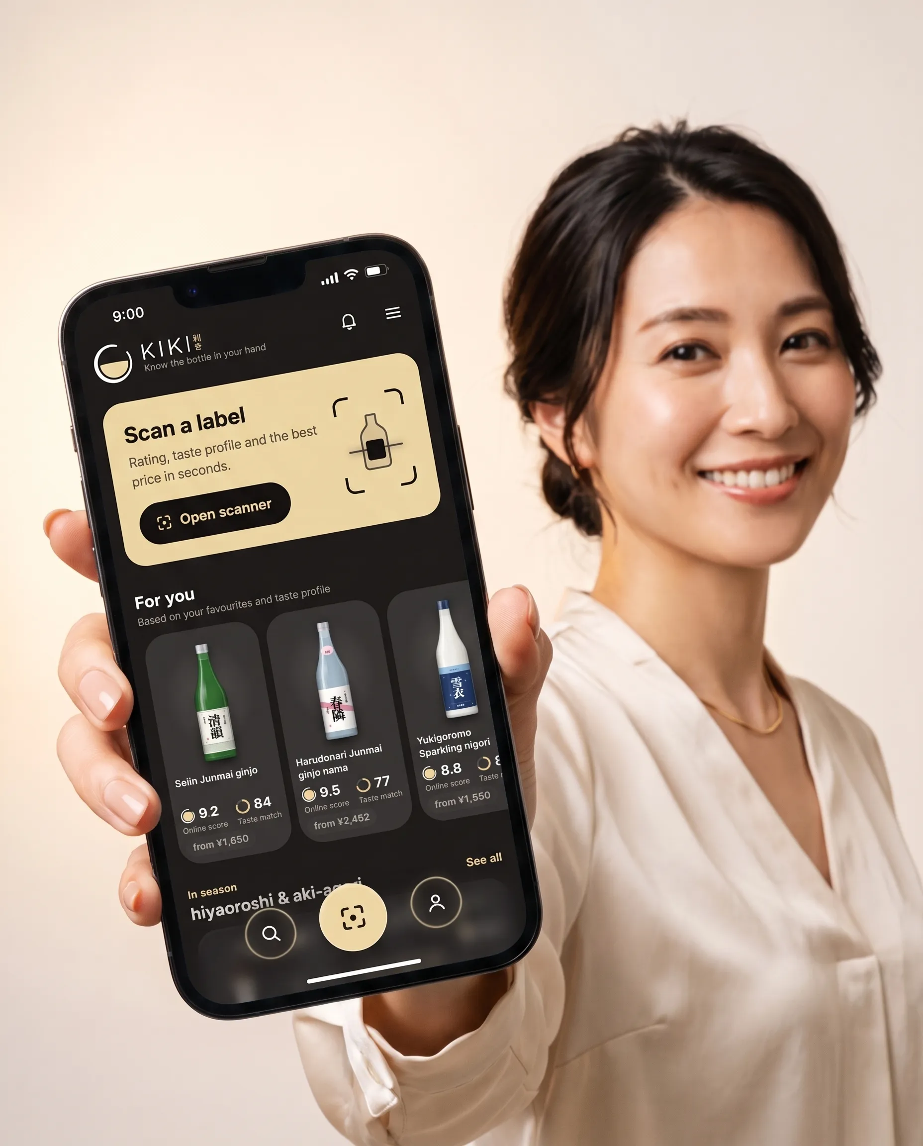 A woman holding up her phone with the app on screen